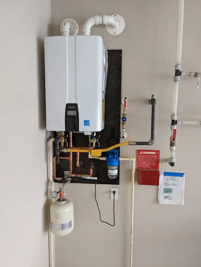 Professional plumber installing copper piping in a Ladera Heights home